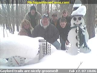 Tom, Pam and Cody Wyatt with Roger, Kevin and Teri standing next to the snowman.