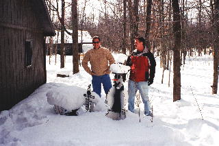 Gary and Gilles from Fremont Ohio standing next to the snowman.